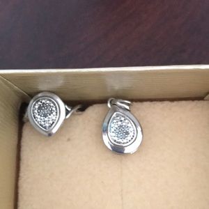 Sterling silver and diamond clusters ring and pendant set.